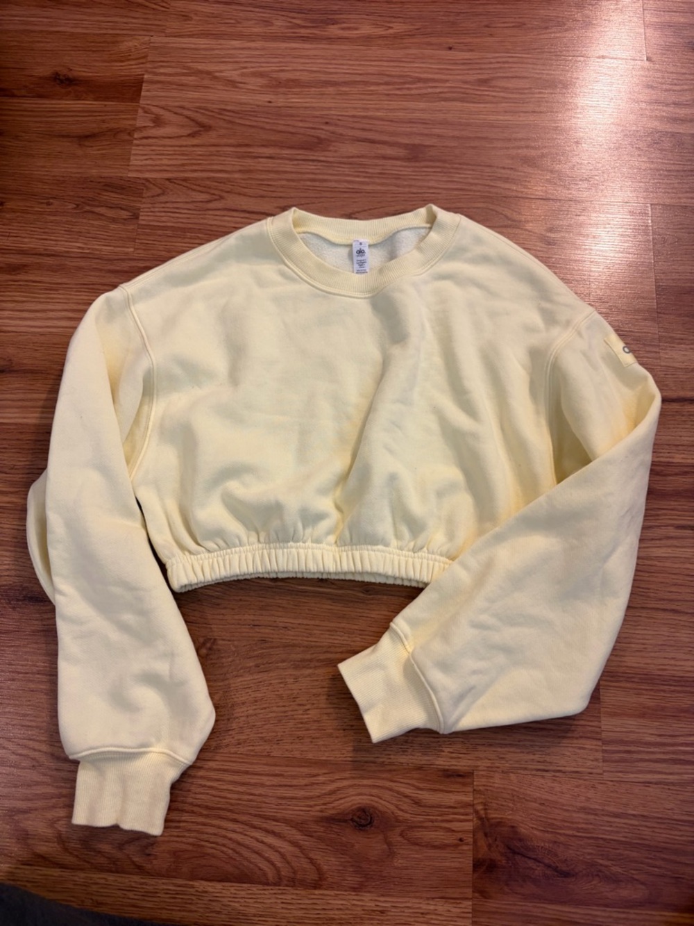 ALO Yoga Cropped Long Sleeve Sweatshirt in Pale Yellow